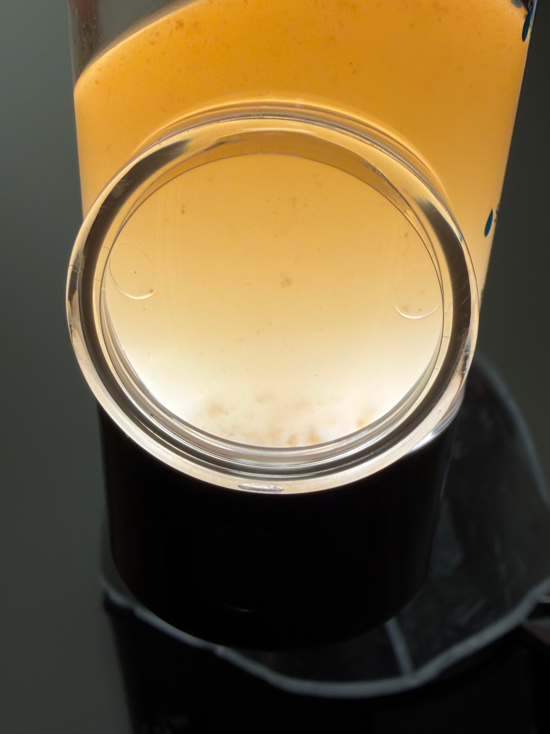 HydraFacial collection showing fluid and debris removed during extraction at Magic Mirror MedSpa