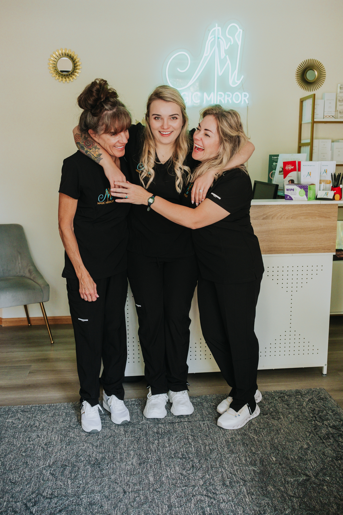 Verna, Brianna and Nicole sharing a moment at Magic Mirror Med Spa